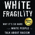 White Fragility cover, white text on black background with title splintered like broken glass