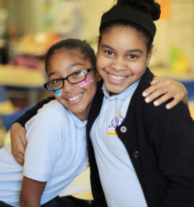 YW Boston FYRE Initiative girls program two girls smiling